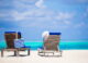 lounge chairs with bag and hat on tropical beach a 2026 03 18 17 35 20 utc1